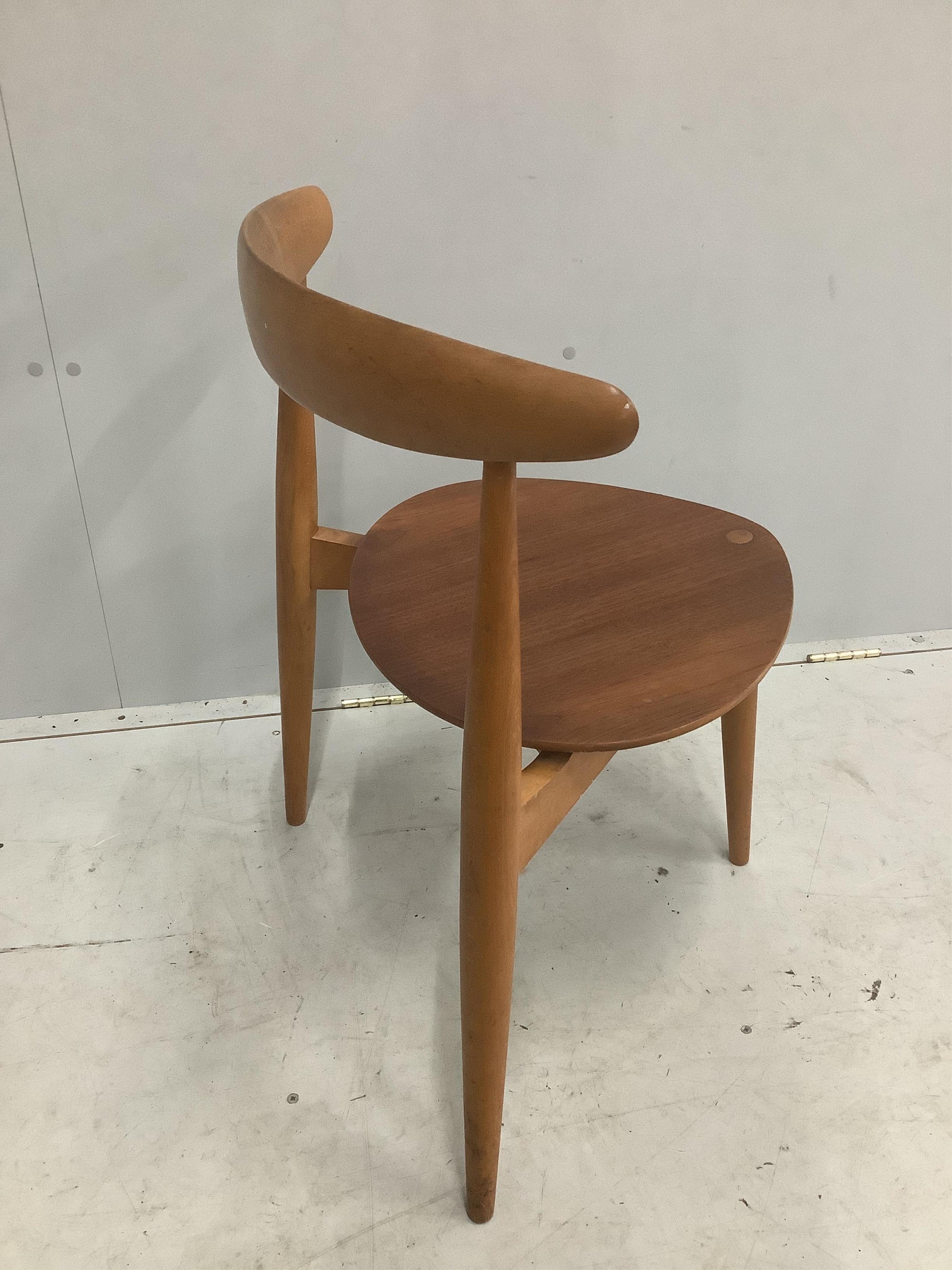 A Hans Wegner for Fritz Hansen 'Heart' dining chair, in beech and teak, Danish circa 1952, width 53cm, depth 40cm, height 73cm. Condition - fair